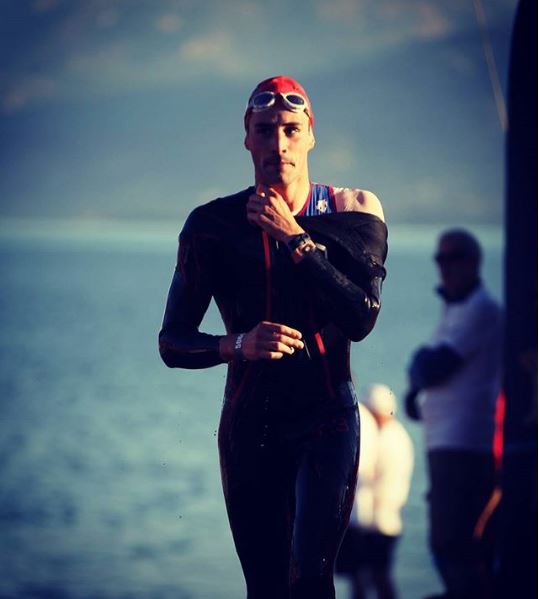 Triathlete in wet suit after a swim